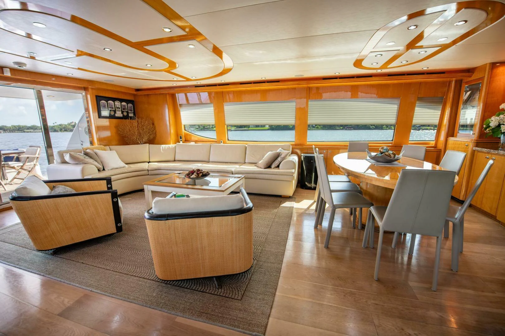 a living room with a table and chairs aboard TIME-2 FLY Yacht for Sale