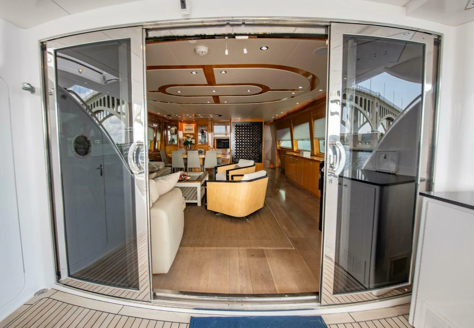 a living room with a sliding glass door aboard TIME-2 FLY Yacht for Sale