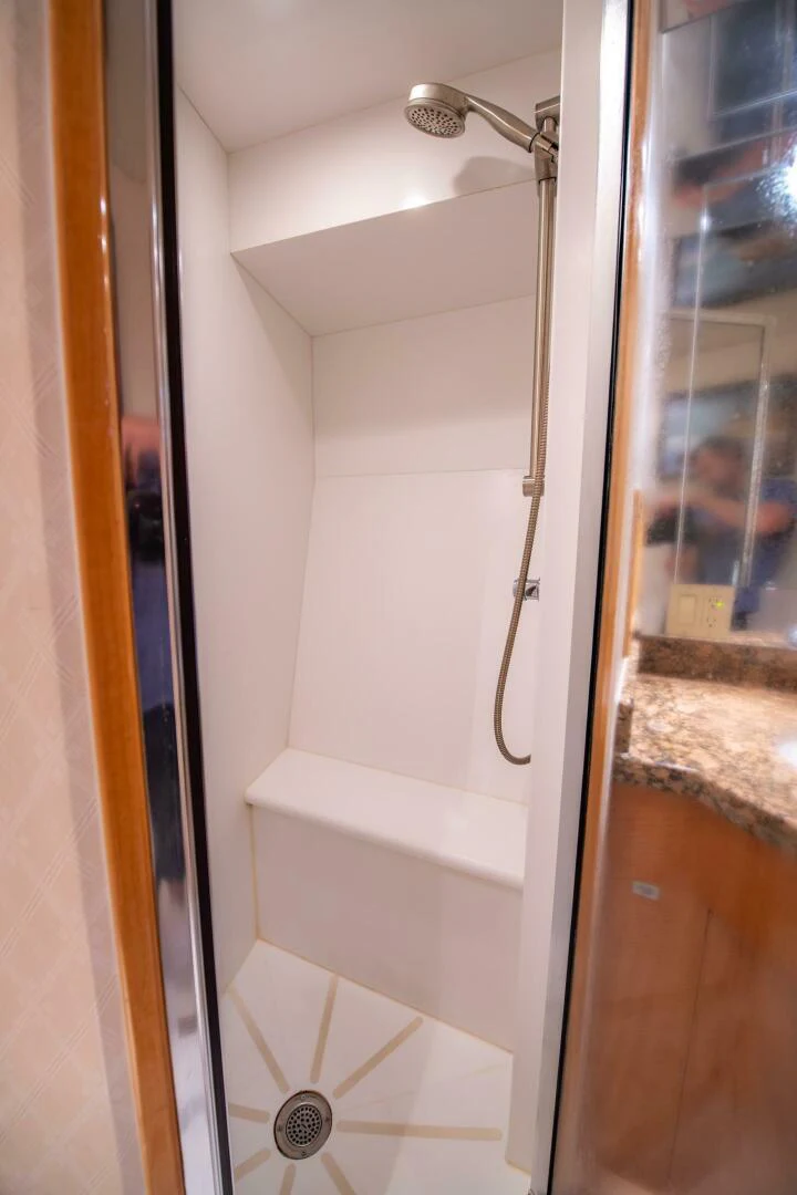 a bathroom with a shower aboard TIME-2 FLY Yacht for Sale