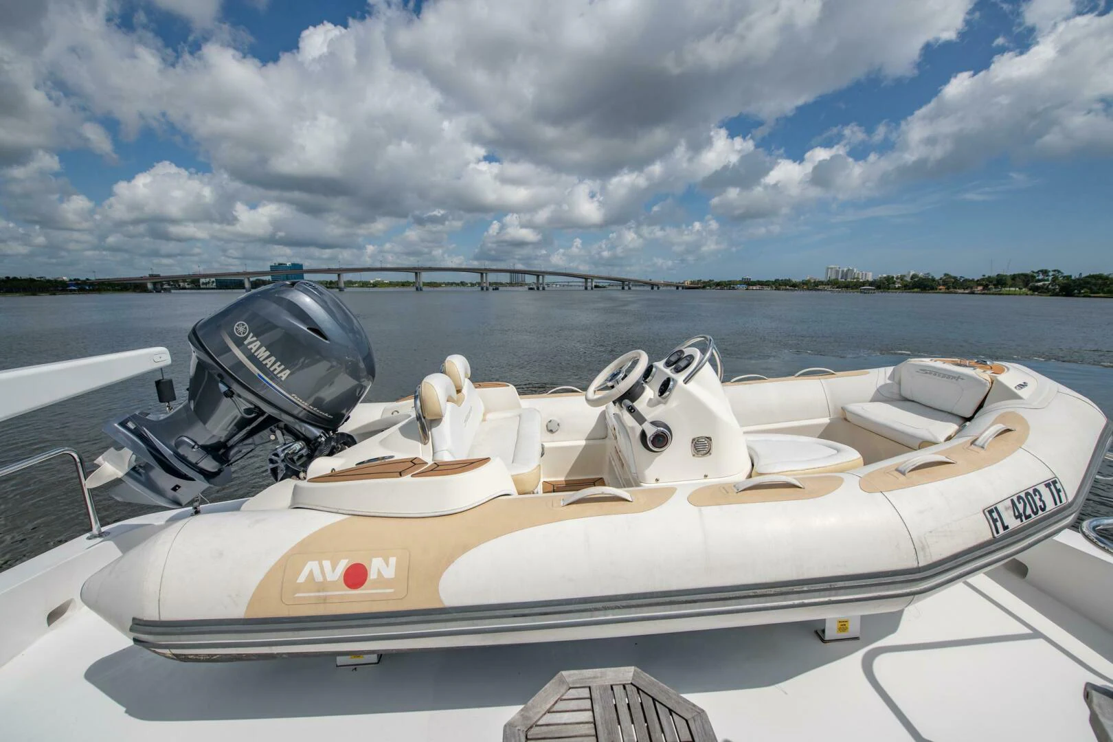 a white boat with a helmet on it aboard TIME-2 FLY Yacht for Sale