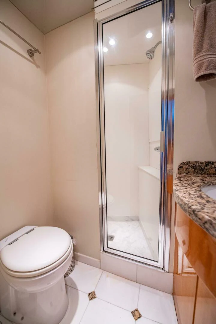 a bathroom with a glass shower aboard TIME-2 FLY Yacht for Sale