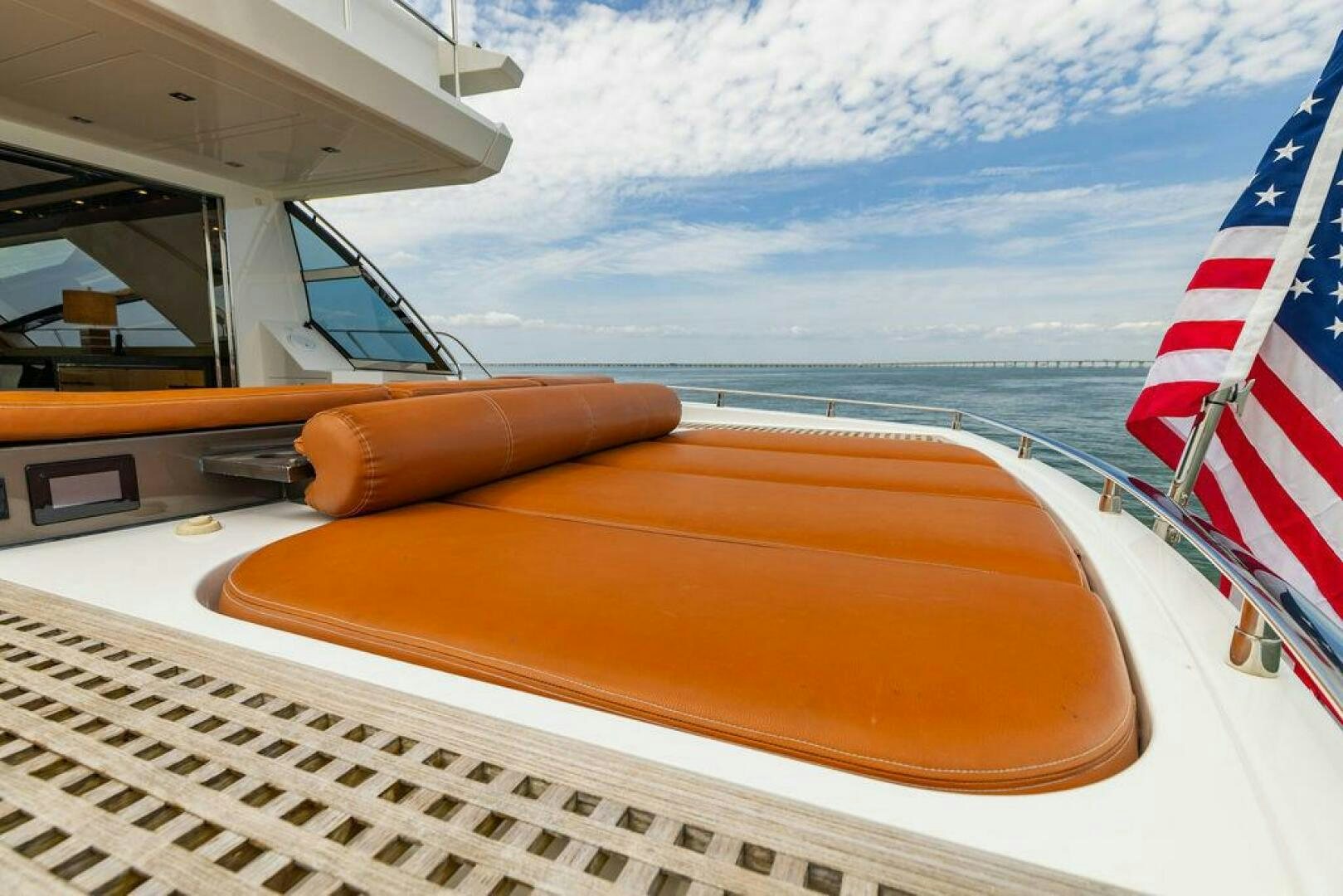 a boat with a flag on the front aboard KNOT GUILTY Yacht for Sale