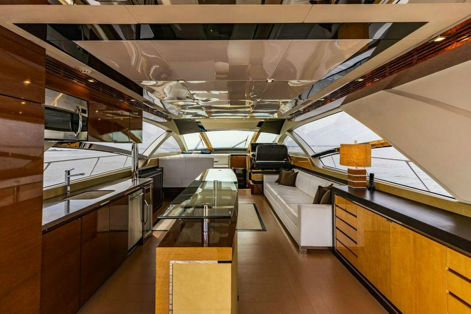 a room with several desks and a large airplane in the background aboard KNOT GUILTY Yacht for Sale