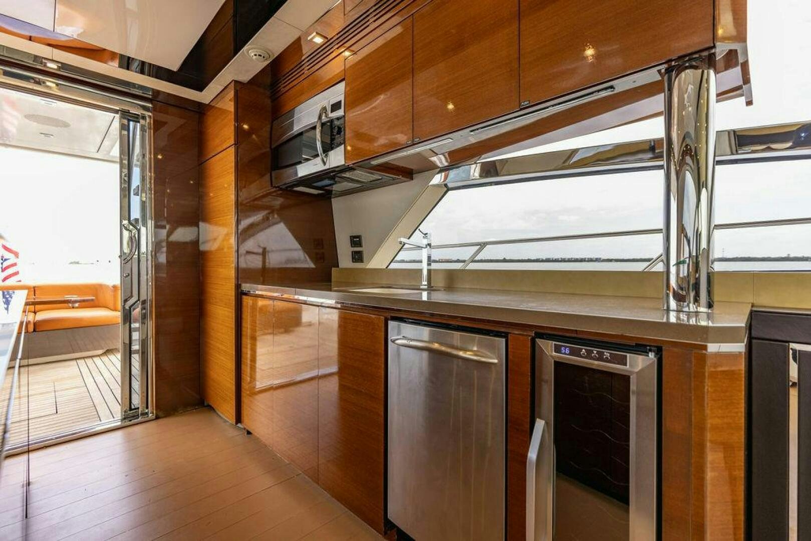 a kitchen with wooden cabinets aboard KNOT GUILTY Yacht for Sale