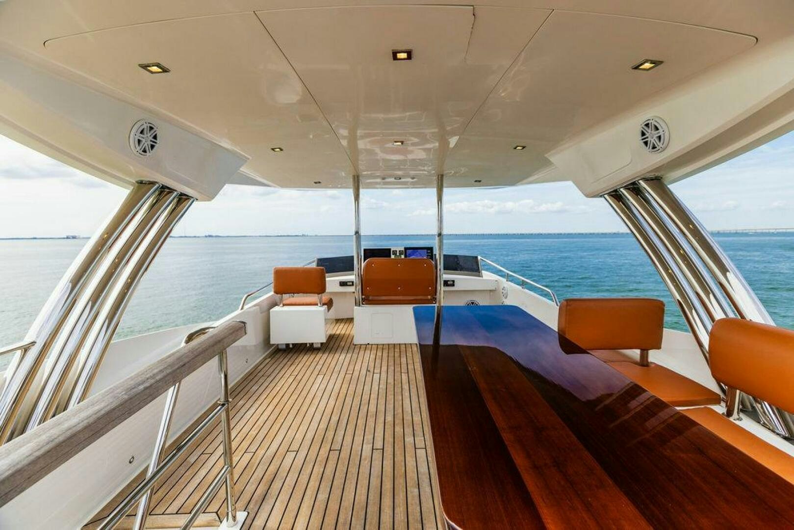 a boat with a deck and chairs aboard KNOT GUILTY Yacht for Sale