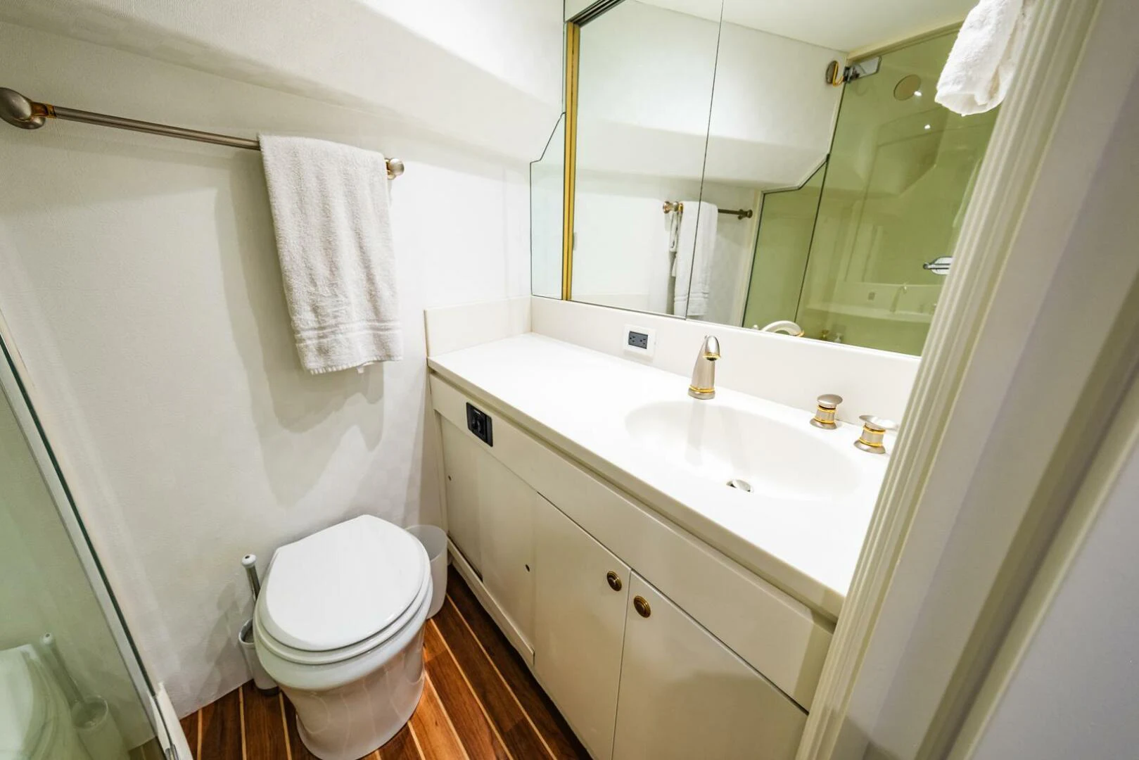 a bathroom with a toilet and a sink aboard GRACE Yacht for Sale