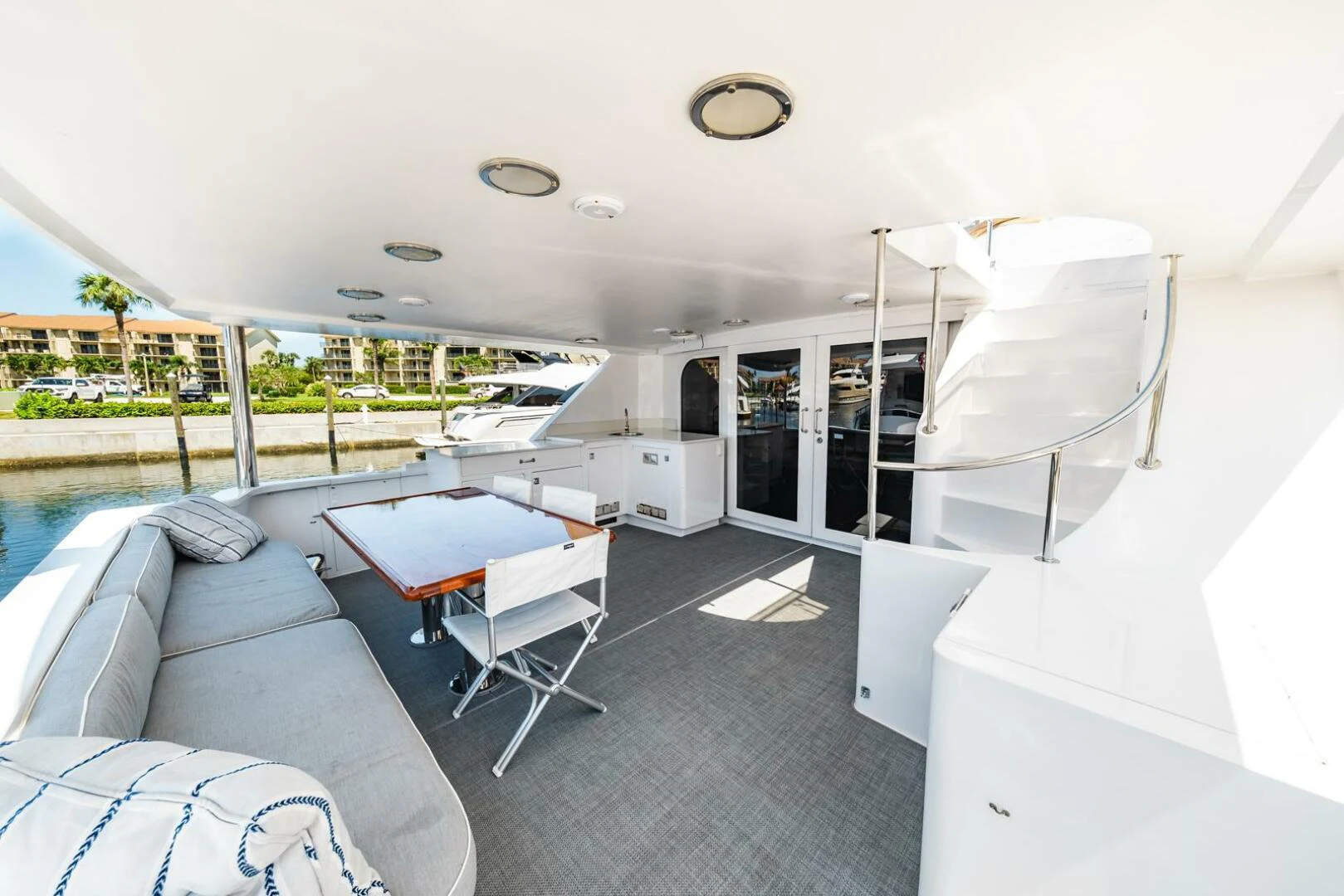 a room with a couch and a table and chairs aboard GRACE Yacht for Sale