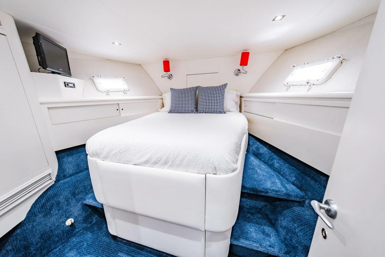 a small room with a bed and a desk aboard GRACE Yacht for Sale