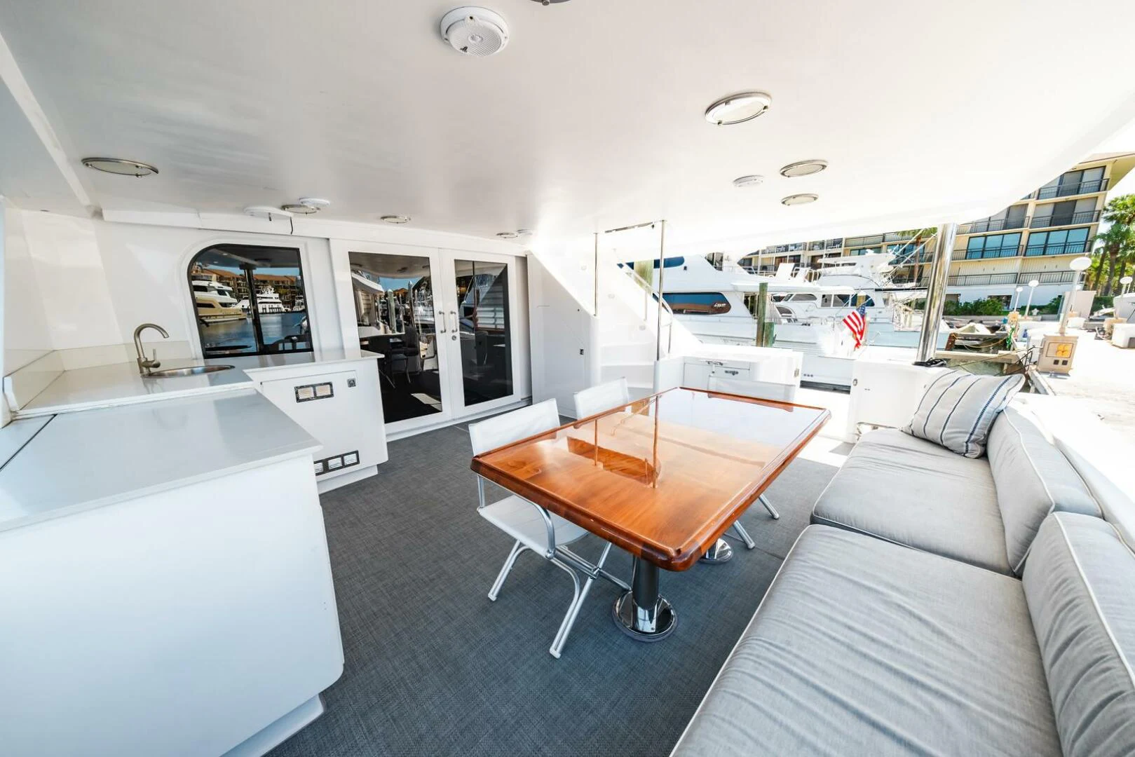 a living room with a couch and a table aboard GRACE Yacht for Sale
