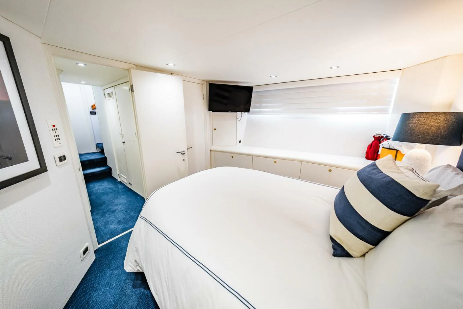 a room with a bed and a television aboard GRACE Yacht for Sale