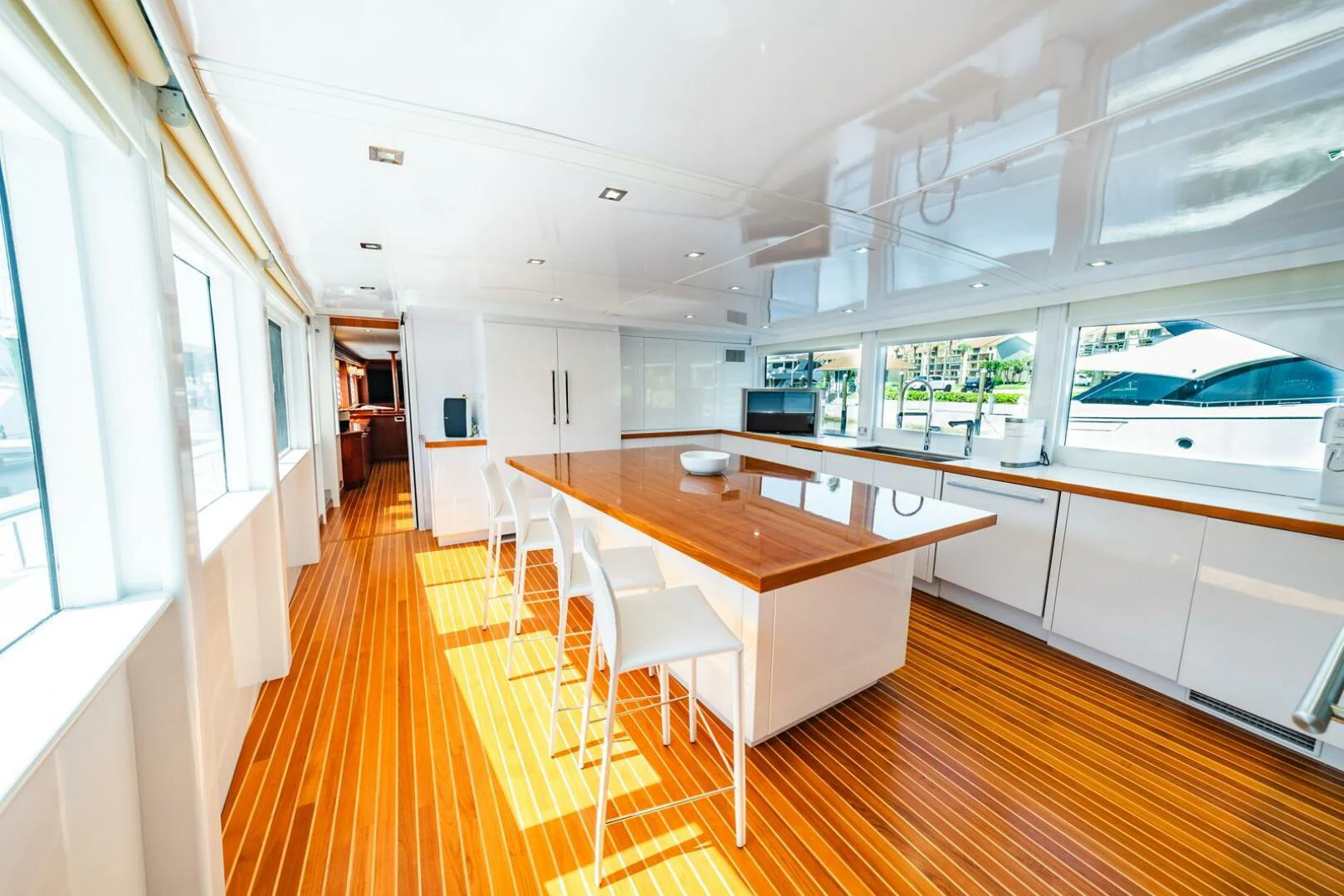 a long wooden table in a room aboard GRACE Yacht for Sale