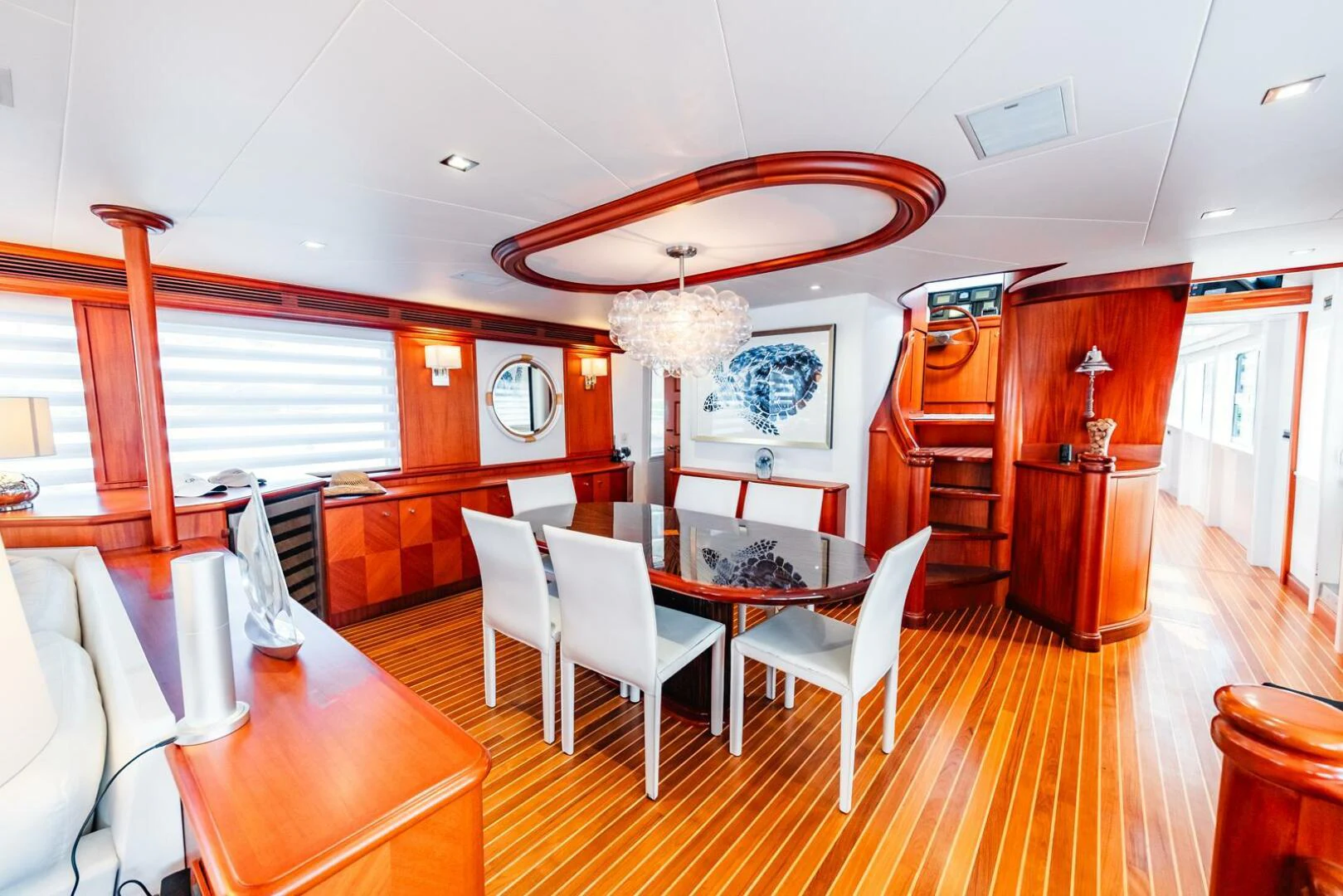 a dining room with a table and chairs aboard GRACE Yacht for Sale
