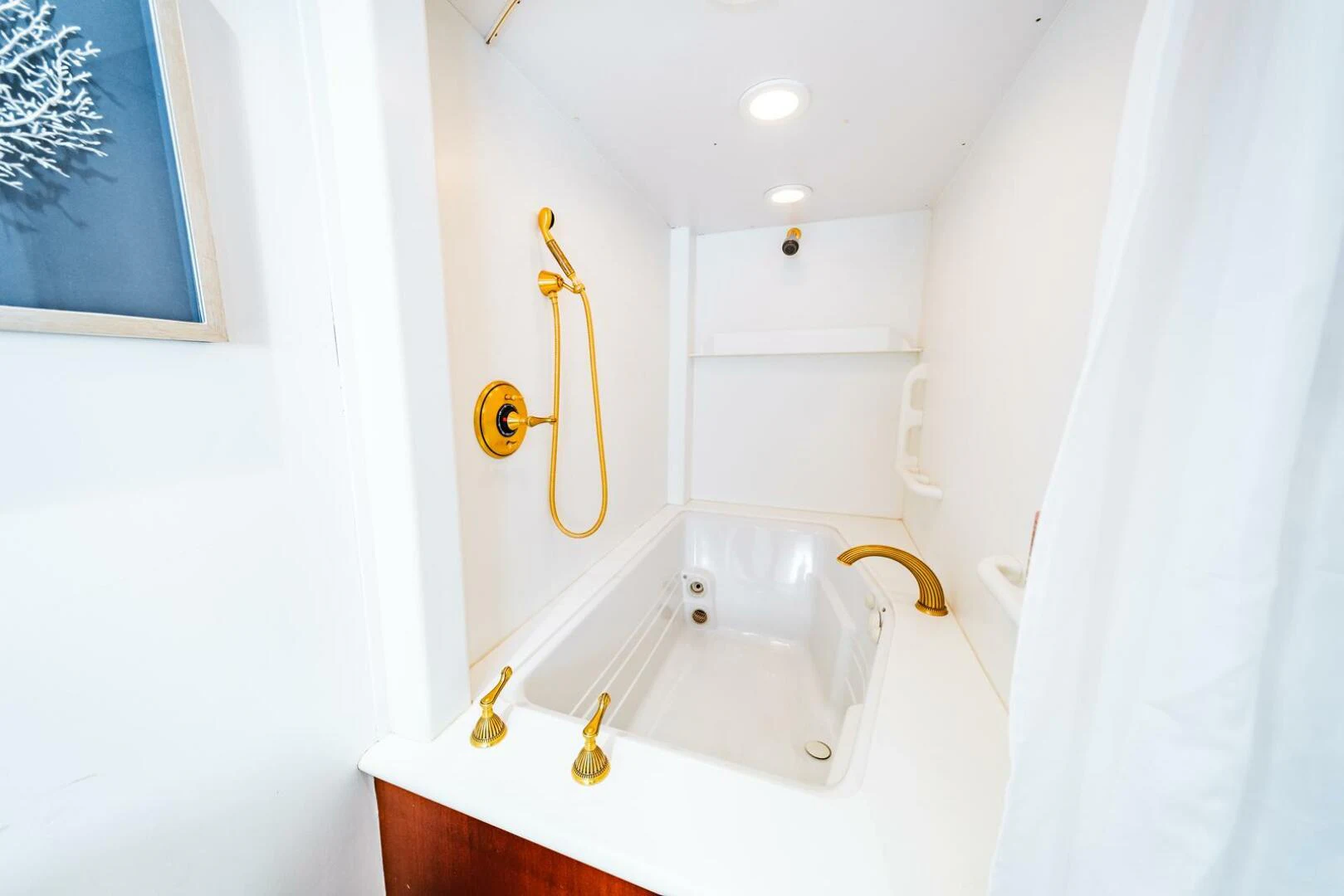 a bathroom with a tub and a sink aboard GRACE Yacht for Sale
