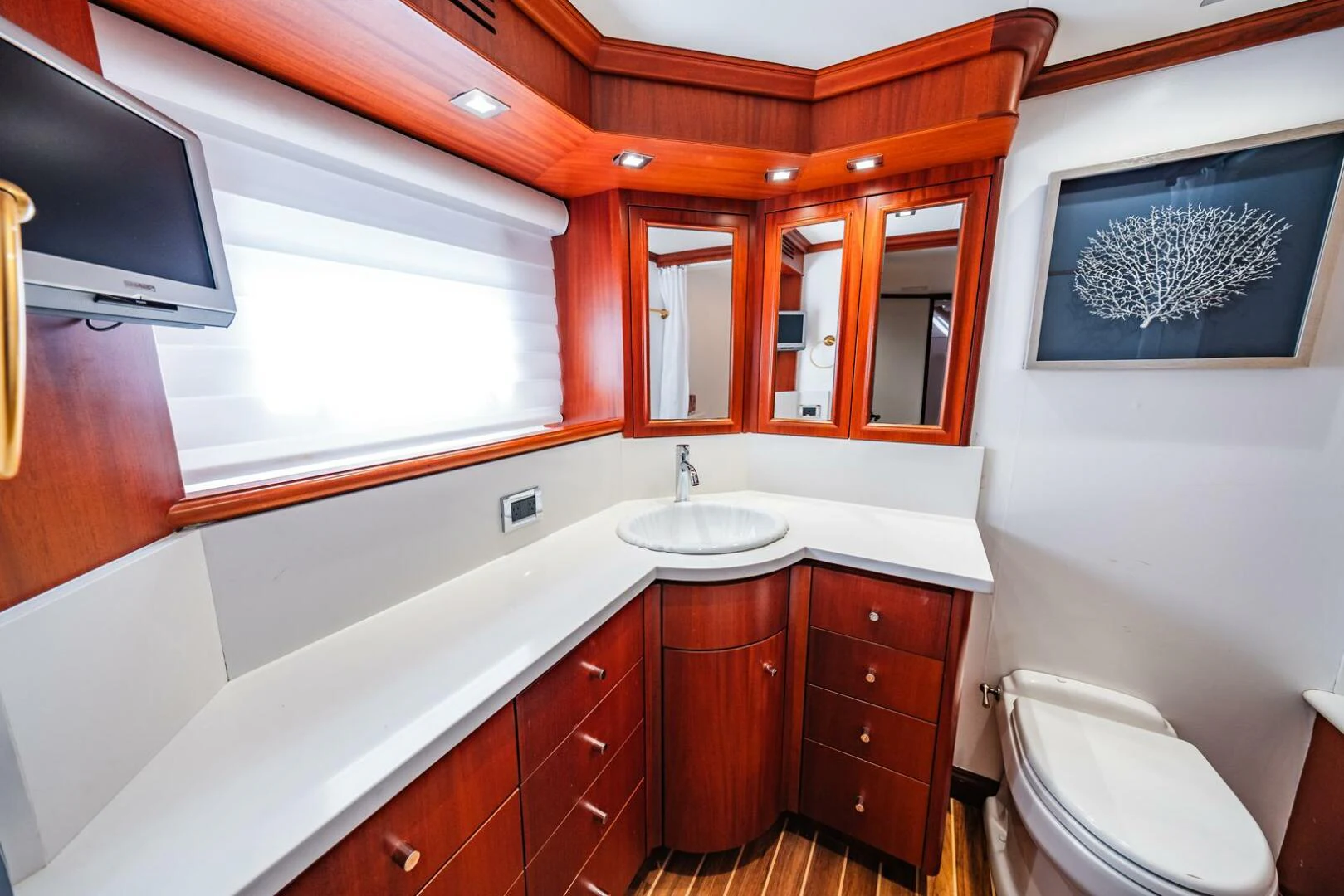 a bathroom with a sink and a toilet aboard GRACE Yacht for Sale