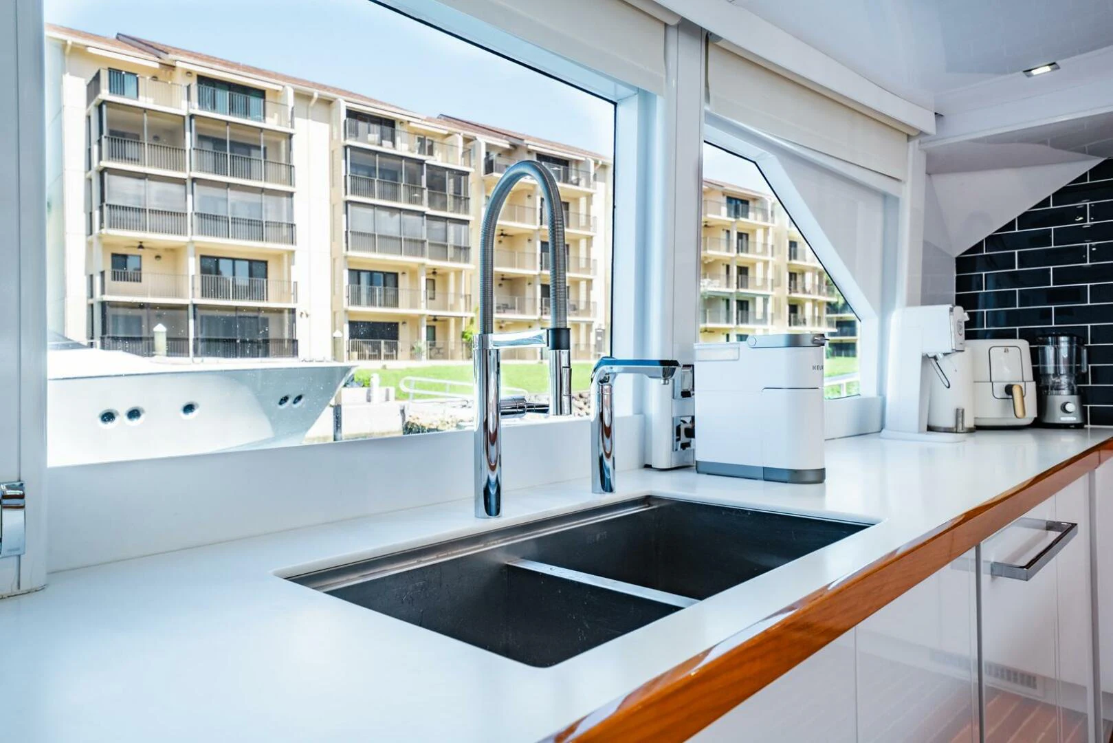 a kitchen with a sink and cabinets aboard GRACE Yacht for Sale