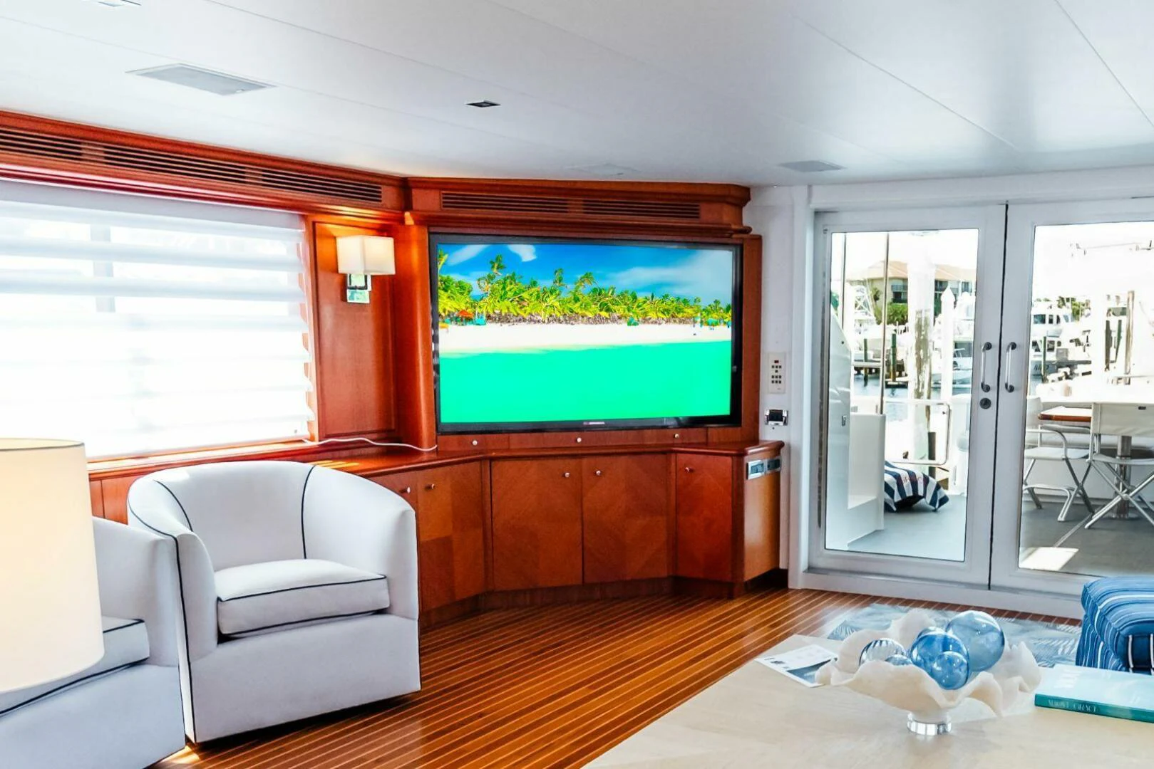 a living room with a tv aboard GRACE Yacht for Sale