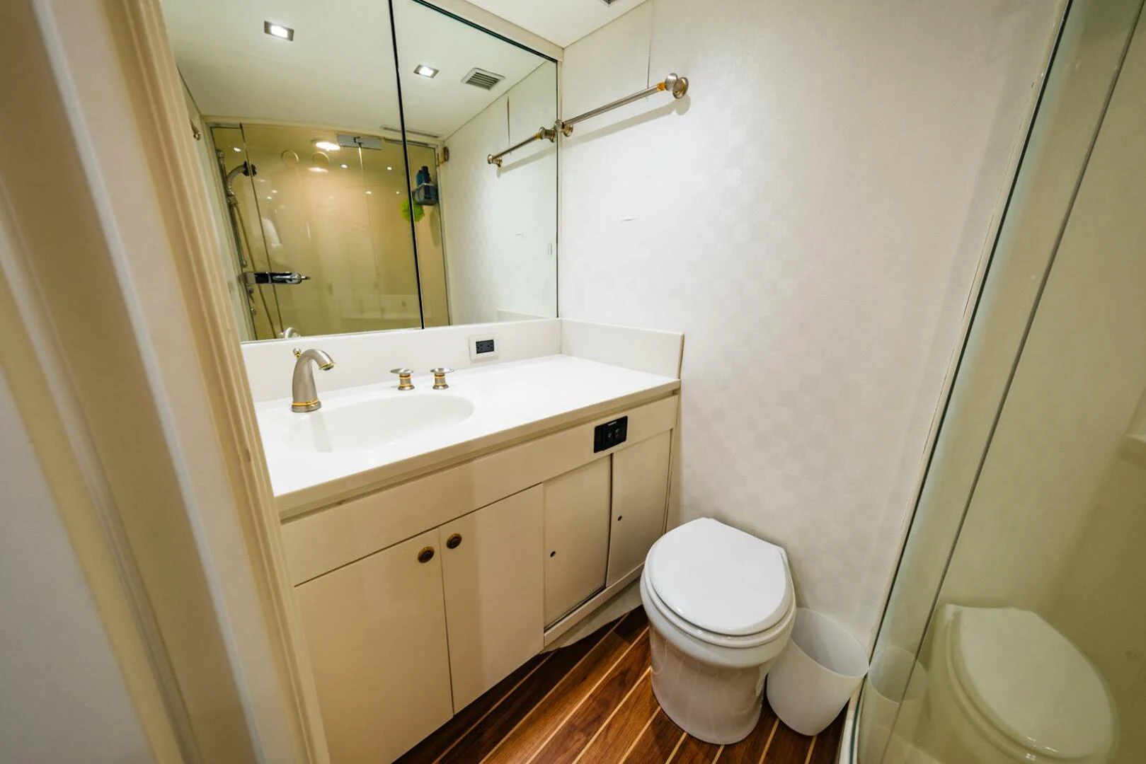 a bathroom with a toilet and sink aboard GRACE Yacht for Sale