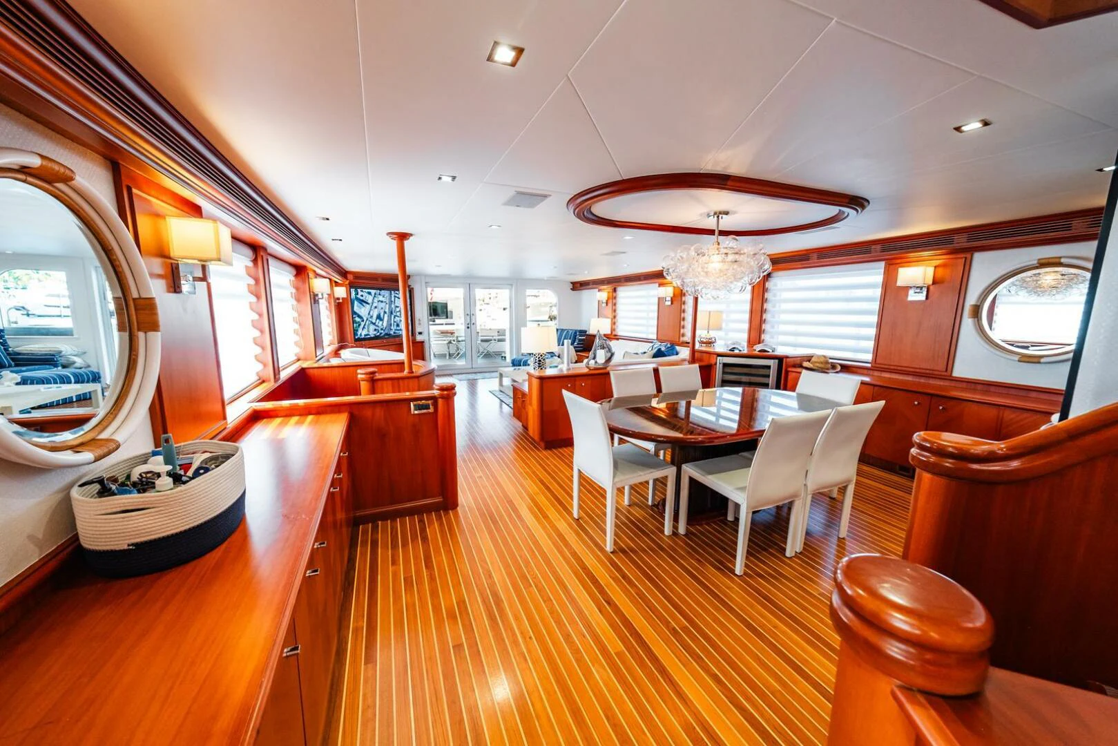 a large room with a table and chairs aboard GRACE Yacht for Sale
