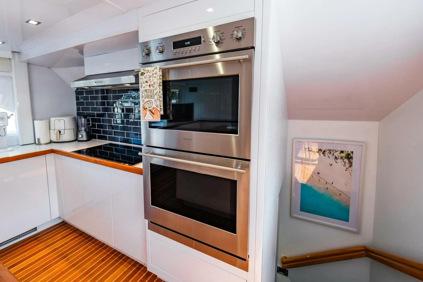 a kitchen with a stove and oven aboard GRACE Yacht for Sale