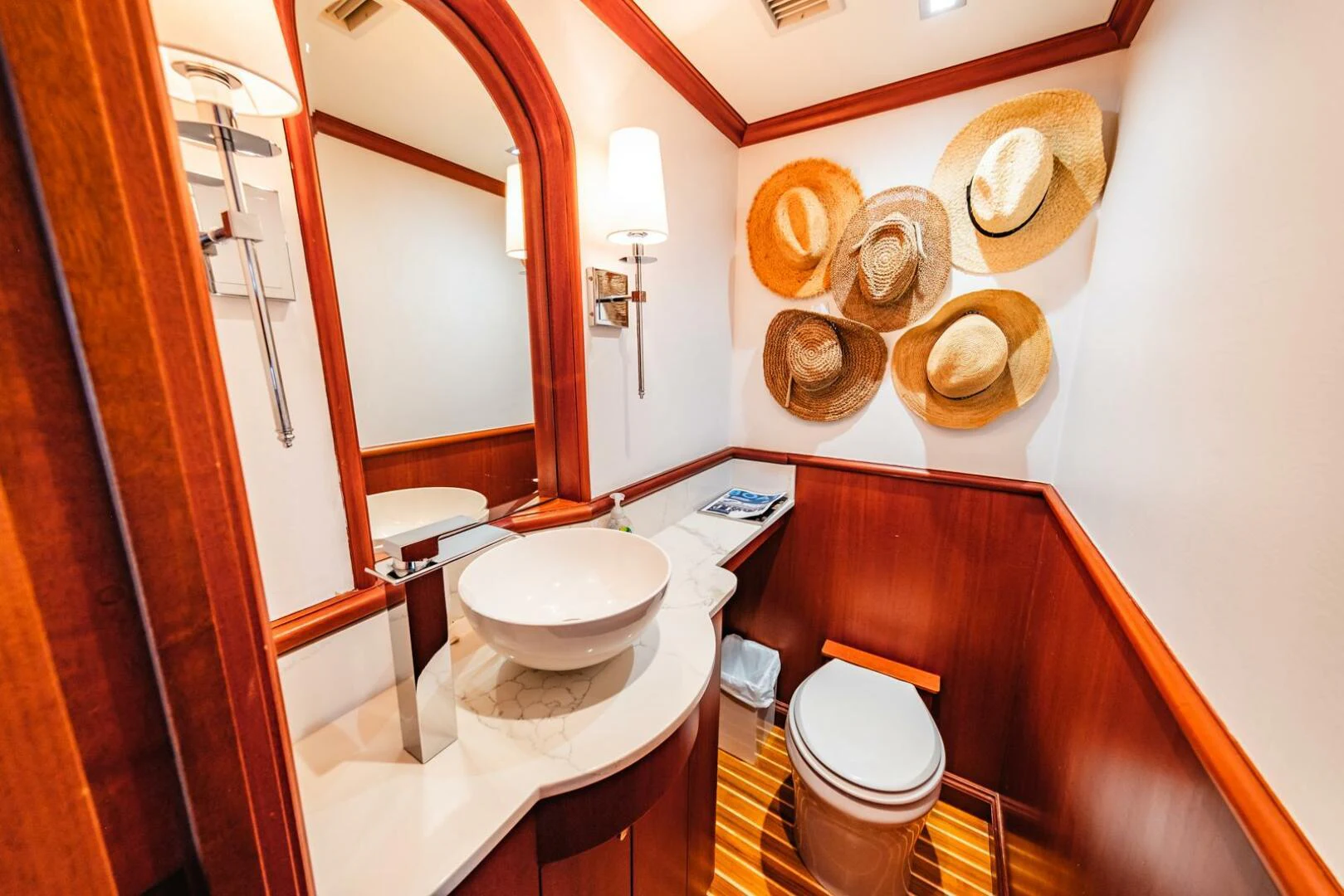 a bathroom with a toilet and a sink aboard GRACE Yacht for Sale