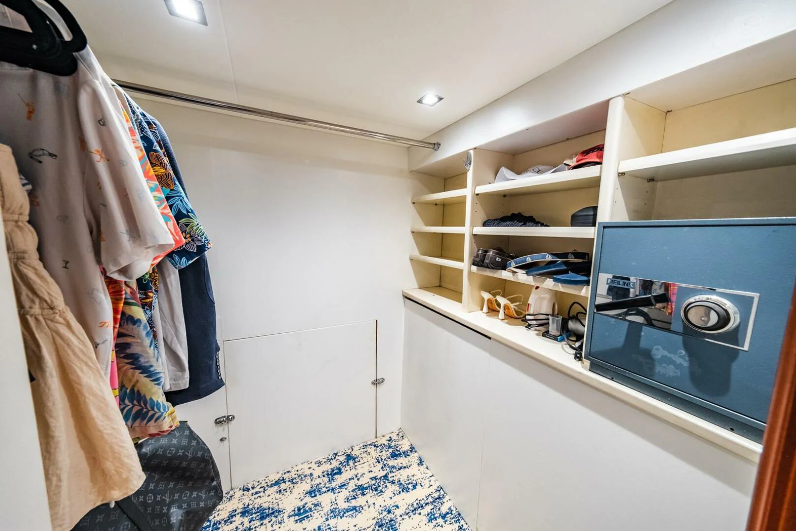 a room with a tv and clothes aboard GRACE Yacht for Sale