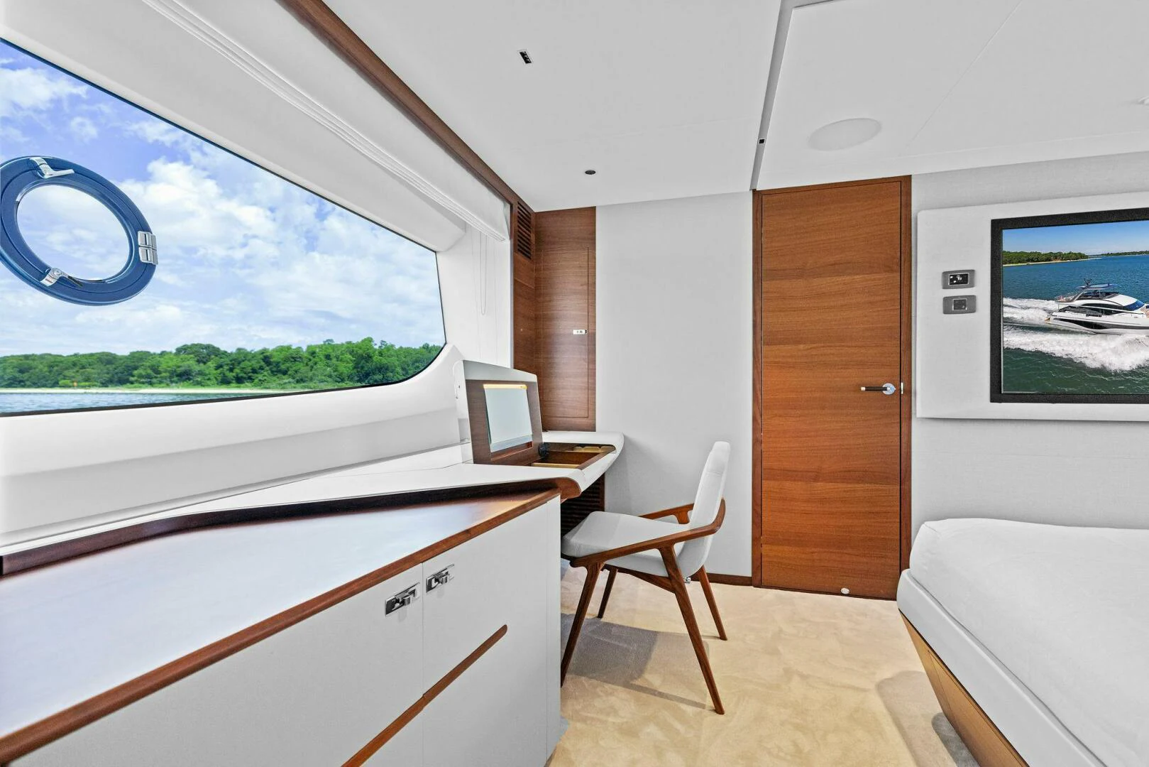 a room with a window and a chair and a bed aboard RAW BAR Yacht for Sale