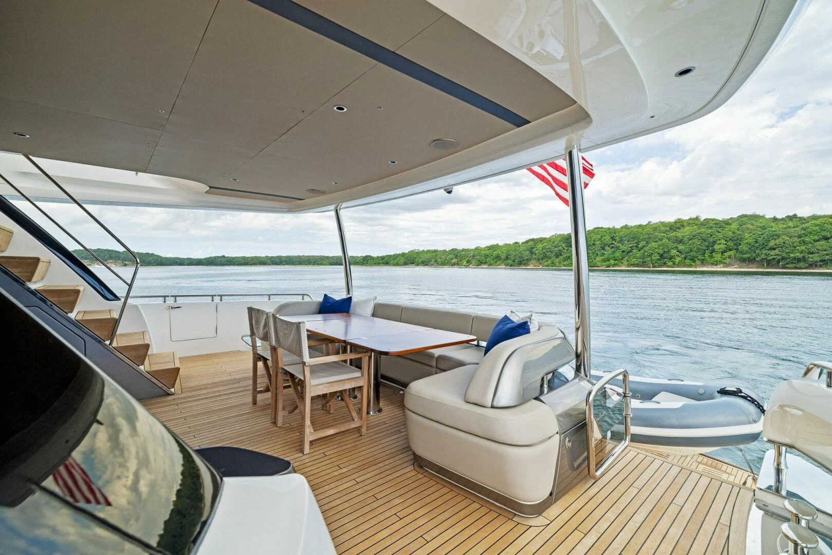 a boat with a table and chairs on it aboard RAW BAR Yacht for Sale
