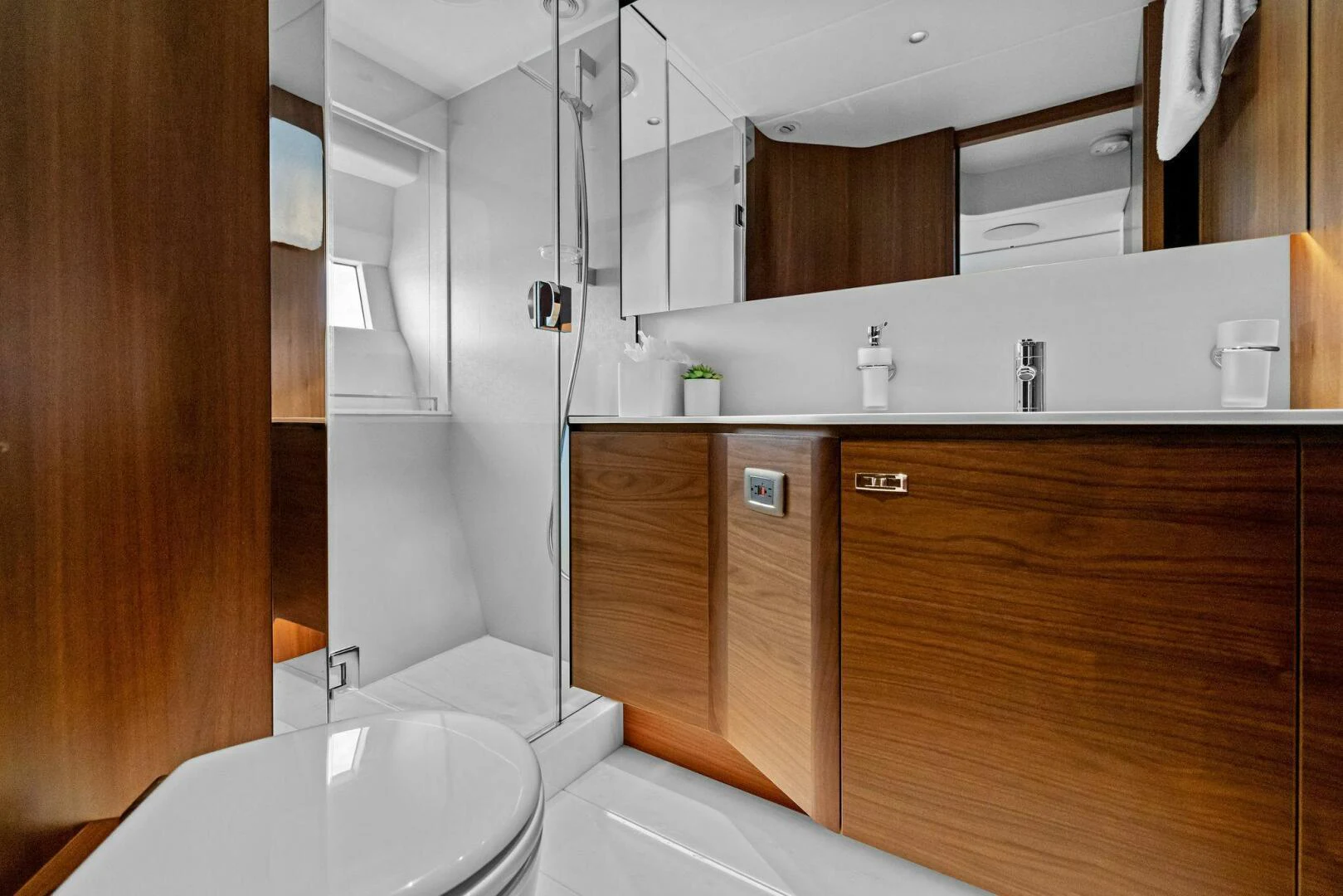 a bathroom with a sink and cabinets aboard RAW BAR Yacht for Sale