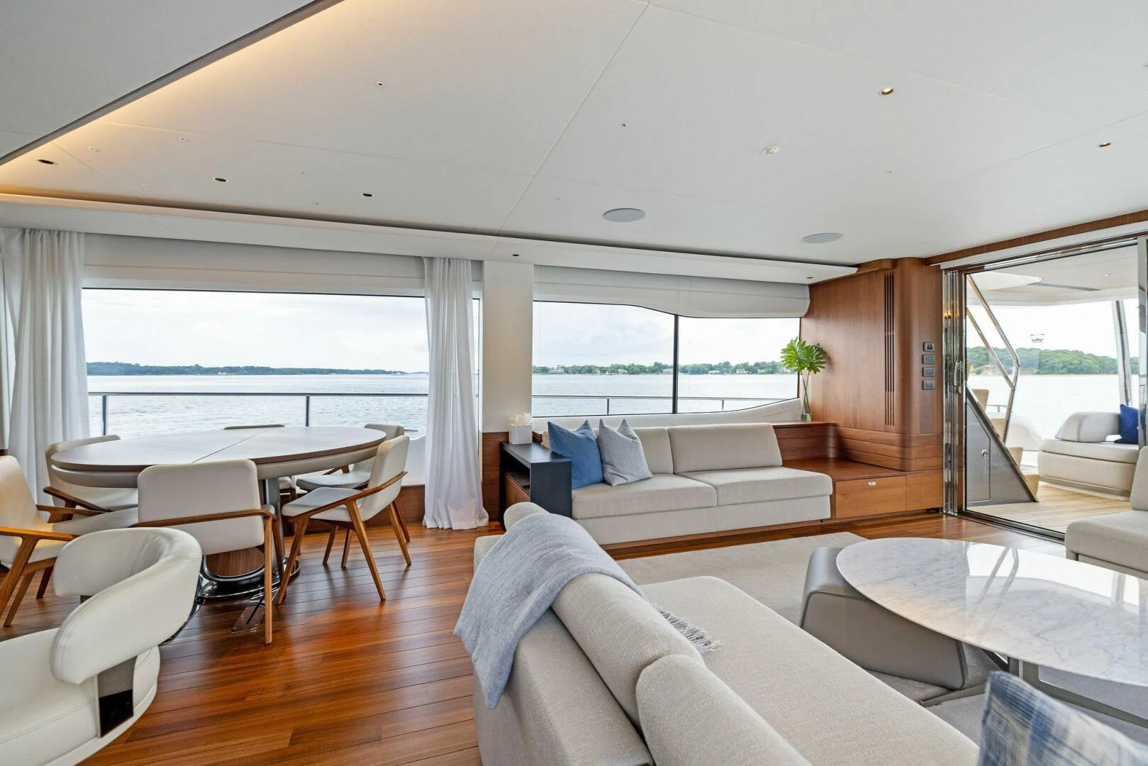 a living room with a large window aboard RAW BAR Yacht for Sale
