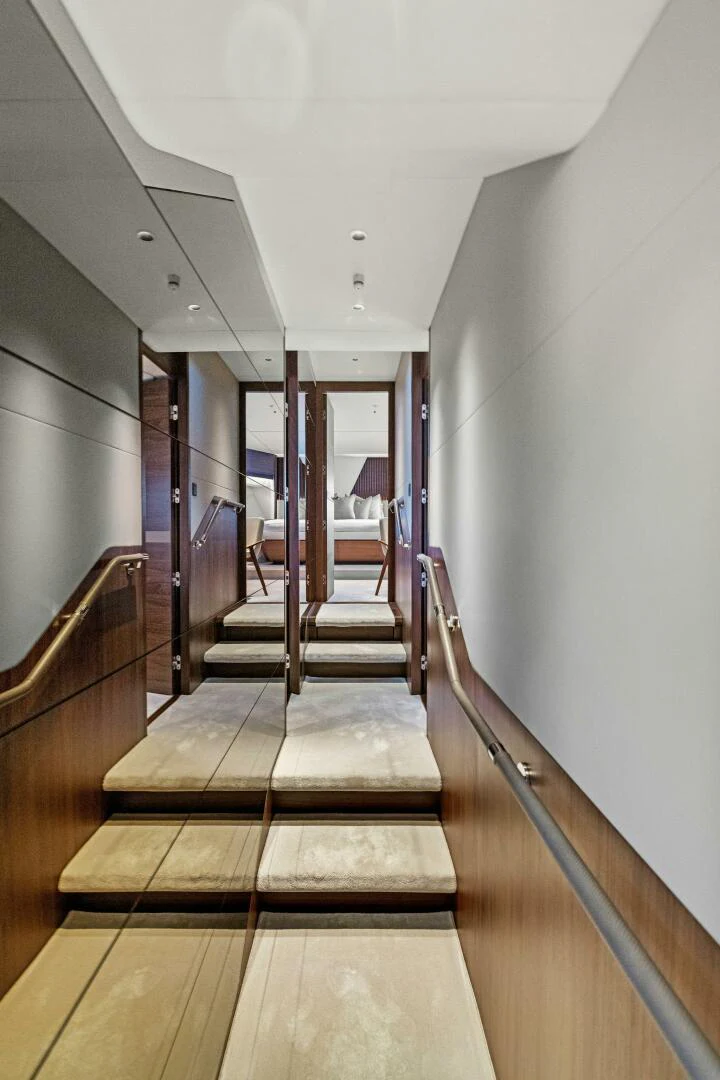 a long wooden staircase aboard RAW BAR Yacht for Sale