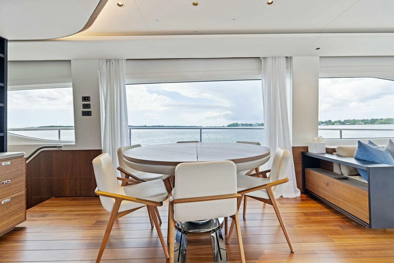 a room with a table chairs and a bed aboard RAW BAR Yacht for Sale