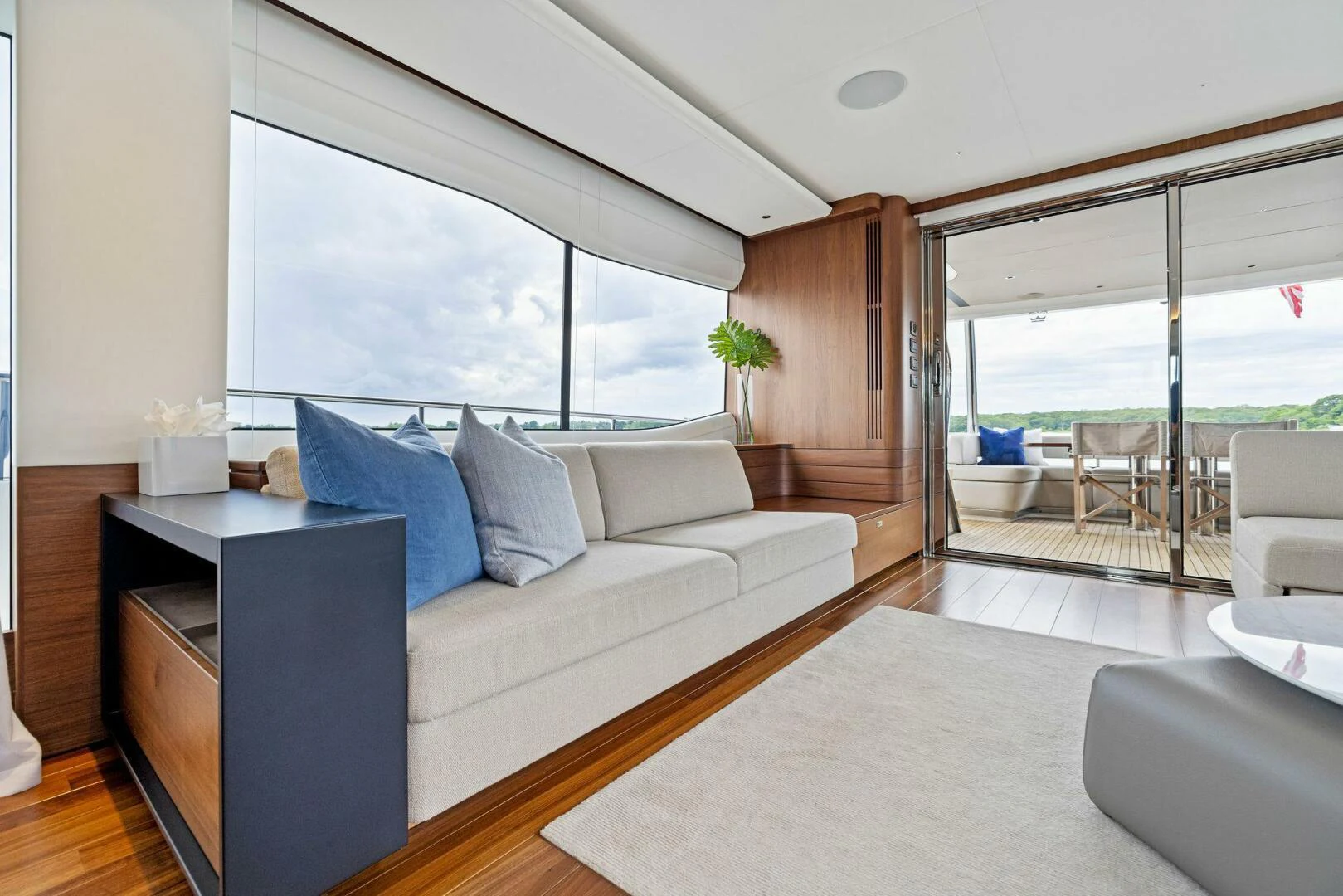 a living room with a large window aboard RAW BAR Yacht for Sale