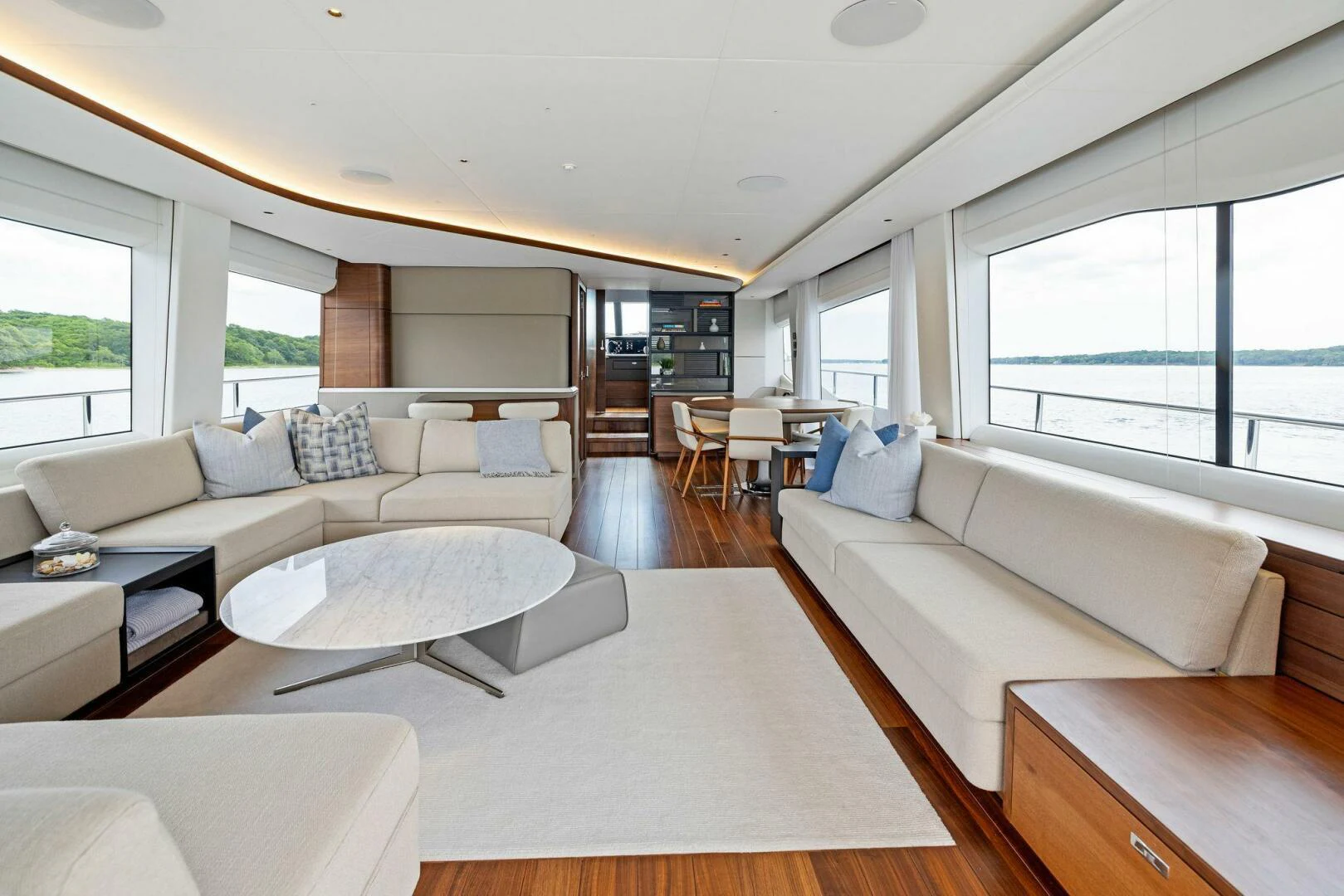 a living room with a couch and a table aboard RAW BAR Yacht for Sale