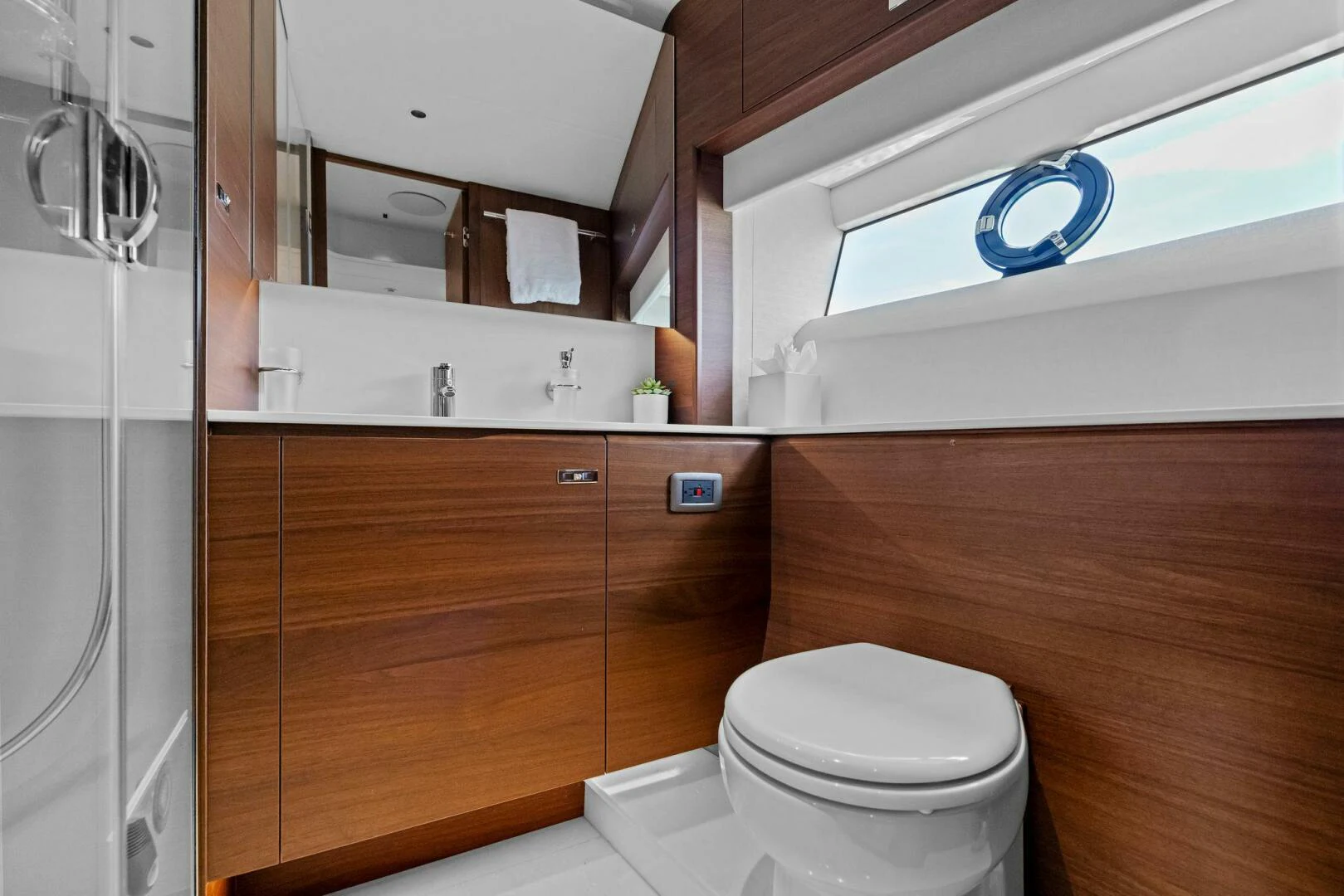 a bathroom with a toilet and a shower aboard RAW BAR Yacht for Sale