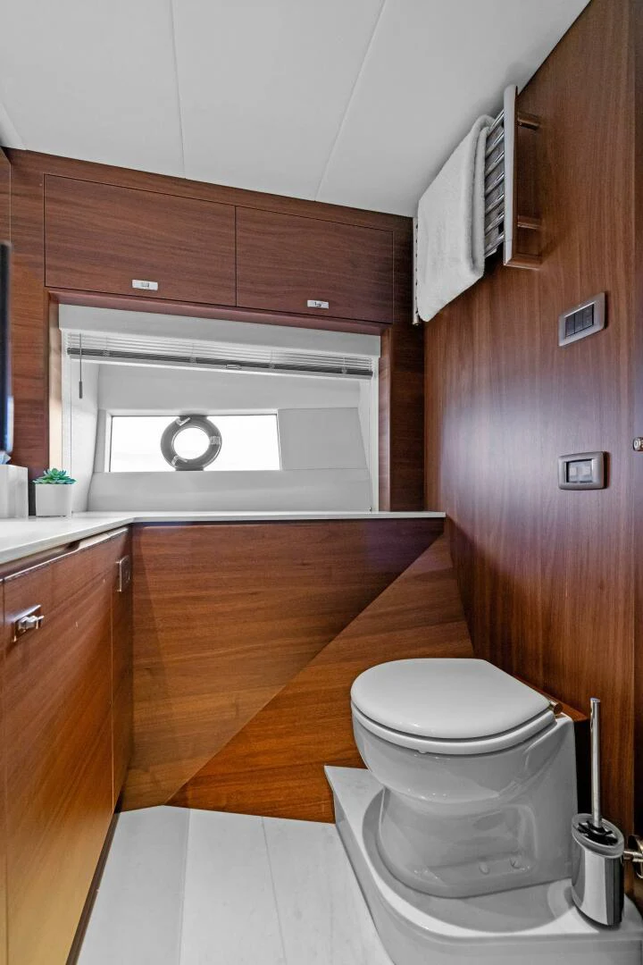 a small bathroom with a toilet aboard RAW BAR Yacht for Sale