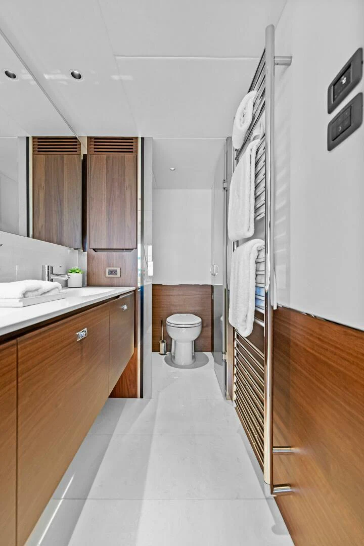 a bathroom with a sink and toilet aboard RAW BAR Yacht for Sale