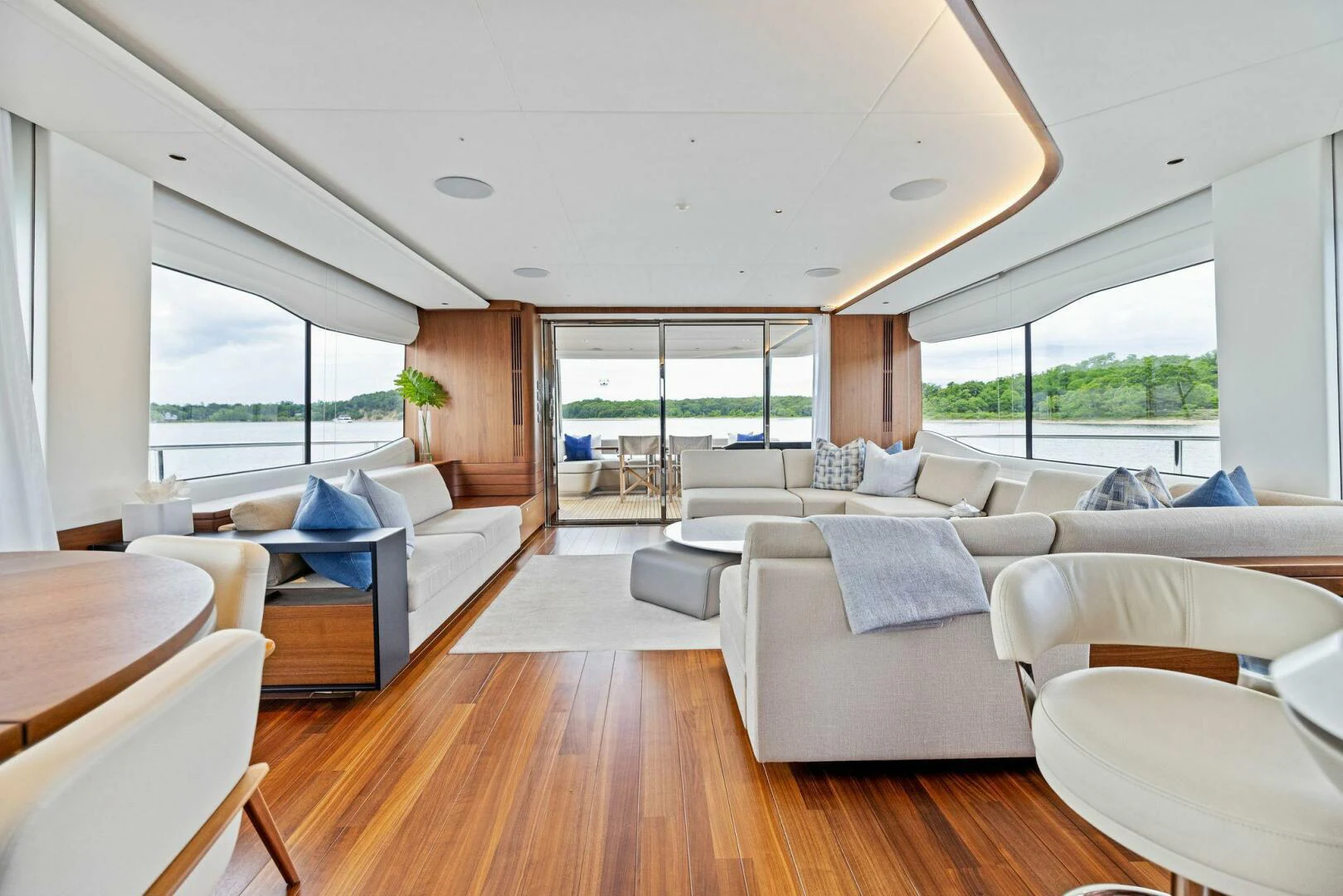 a living room with a large window aboard RAW BAR Yacht for Sale