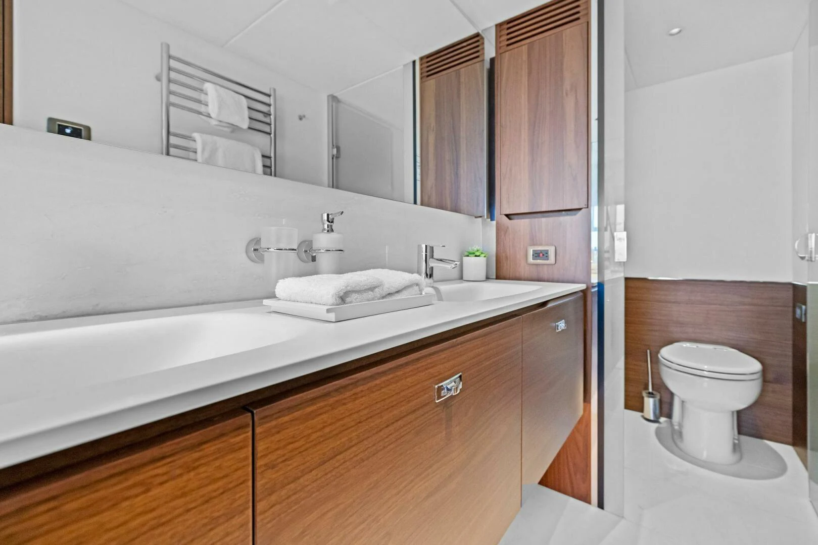 a bathroom with a sink and a toilet aboard RAW BAR Yacht for Sale