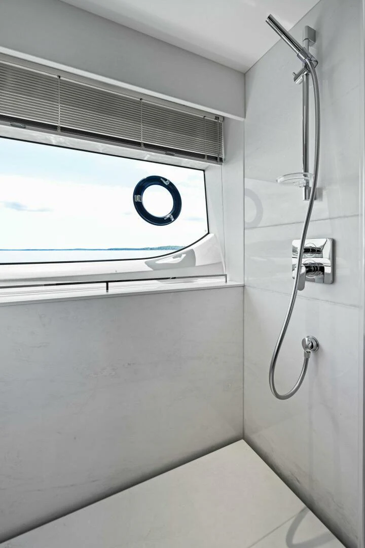 a shower unit with a glass door aboard RAW BAR Yacht for Sale