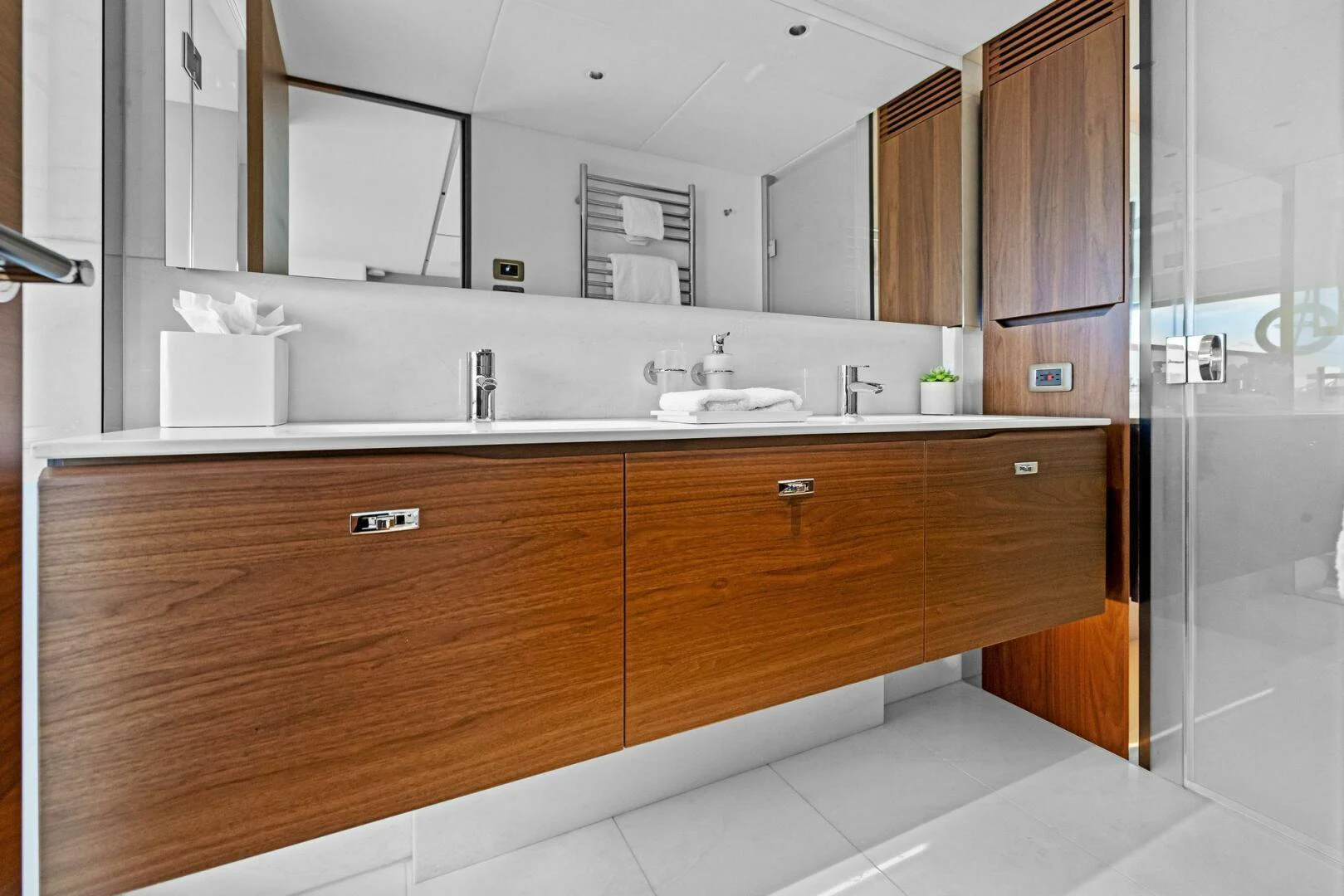 a bathroom with a large mirror aboard RAW BAR Yacht for Sale