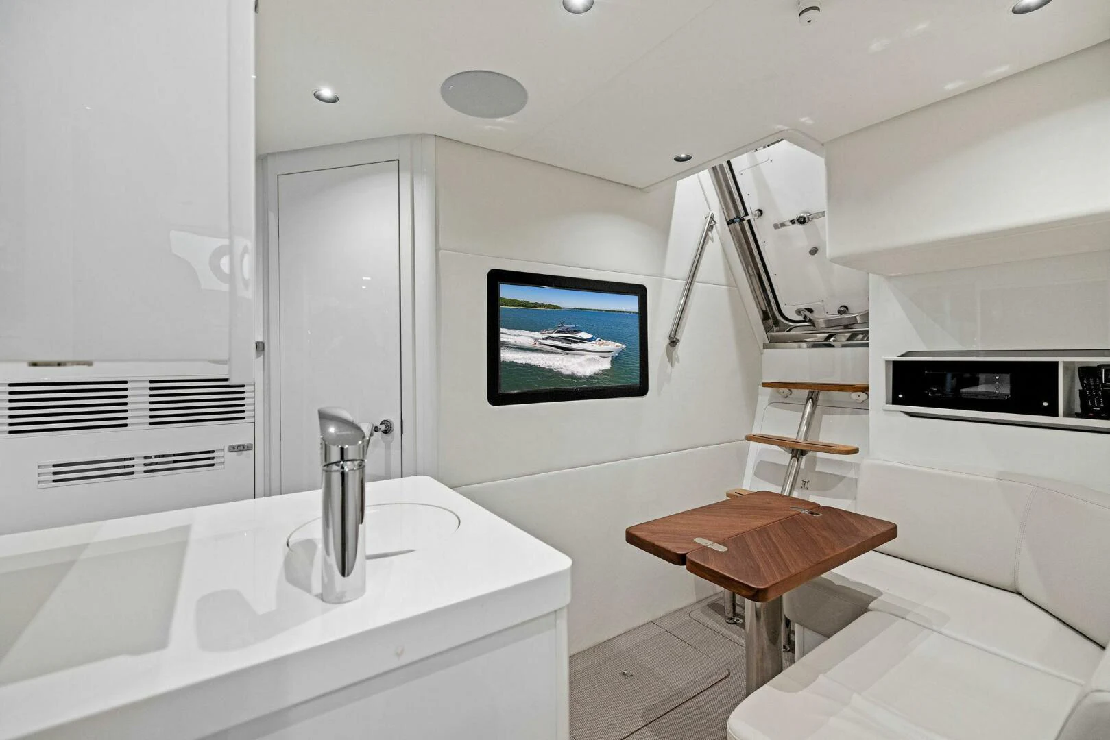 a room with a sink and a bed aboard RAW BAR Yacht for Sale