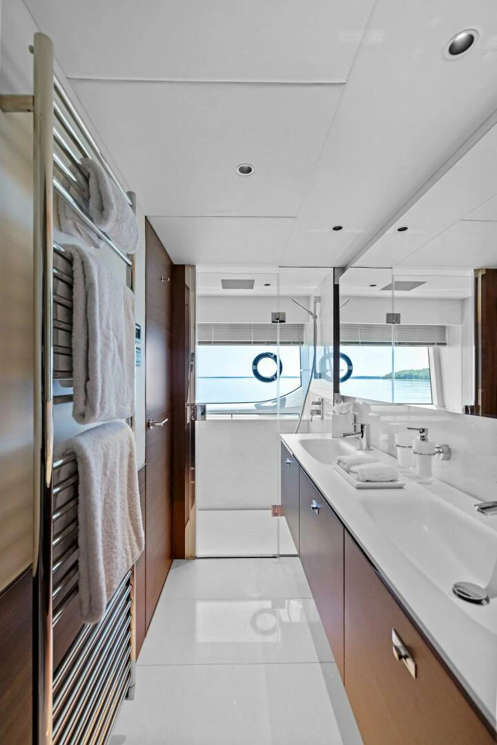 a bathroom with a sink and a shower unit aboard RAW BAR Yacht for Sale