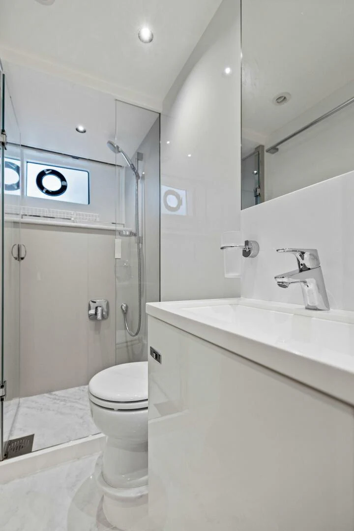 a bathroom with a toilet and sink aboard RAW BAR Yacht for Sale