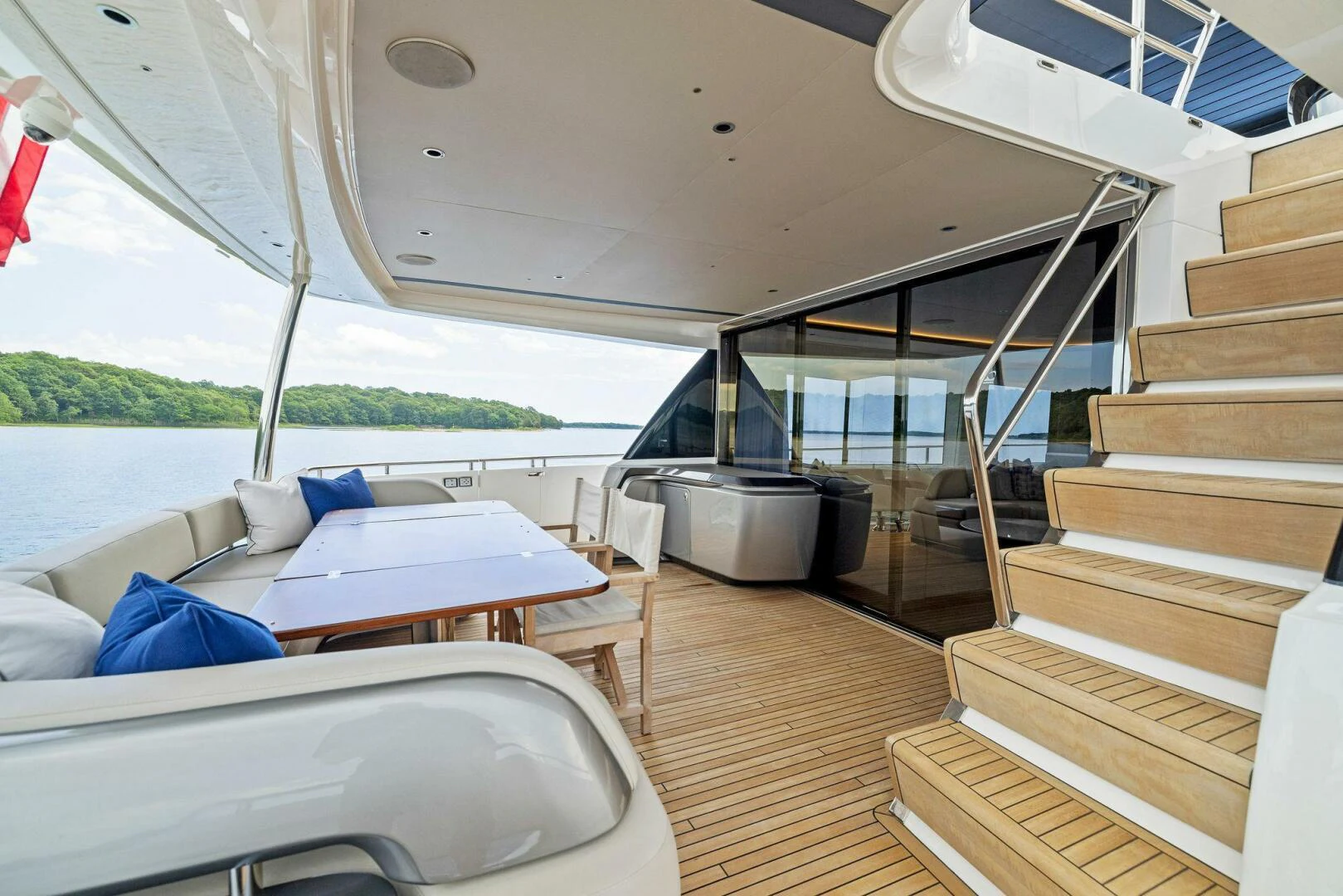 a room with a bed and a table aboard RAW BAR Yacht for Sale