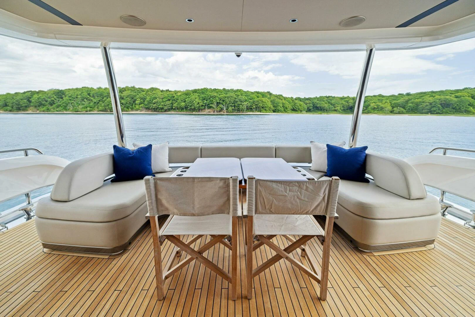a table and chairs on a deck aboard RAW BAR Yacht for Sale