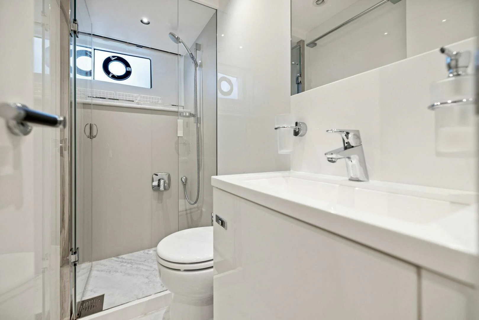 a bathroom with a toilet and sink aboard RAW BAR Yacht for Sale