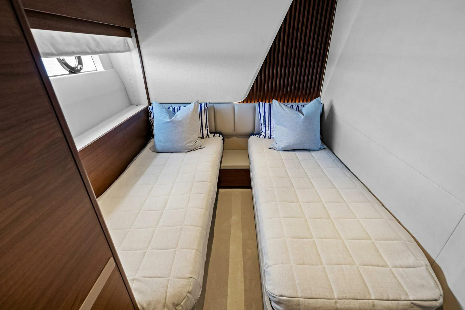 a room with a bed and a pillow on the floor aboard RAW BAR Yacht for Sale