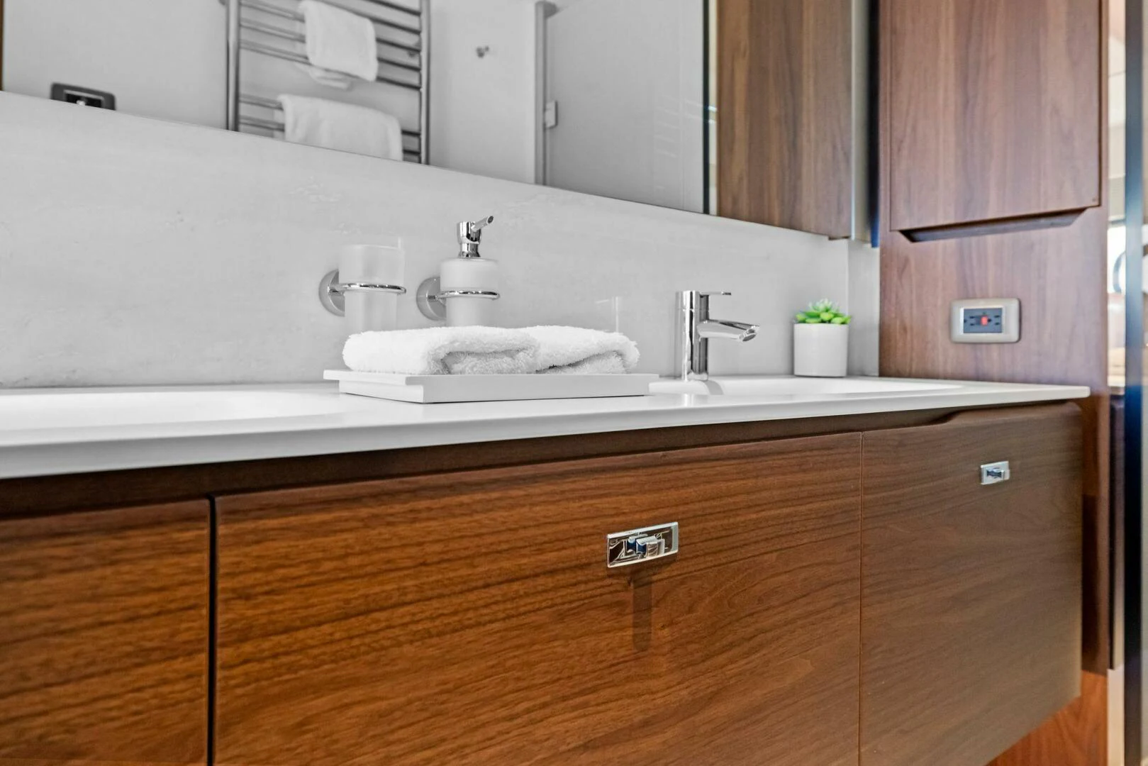 a bathroom with a sink and a mirror aboard RAW BAR Yacht for Sale