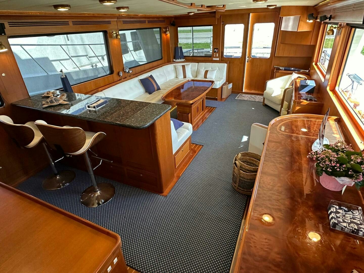 a large room with a table and chairs aboard MISS STEPHANIE  Yacht for Sale