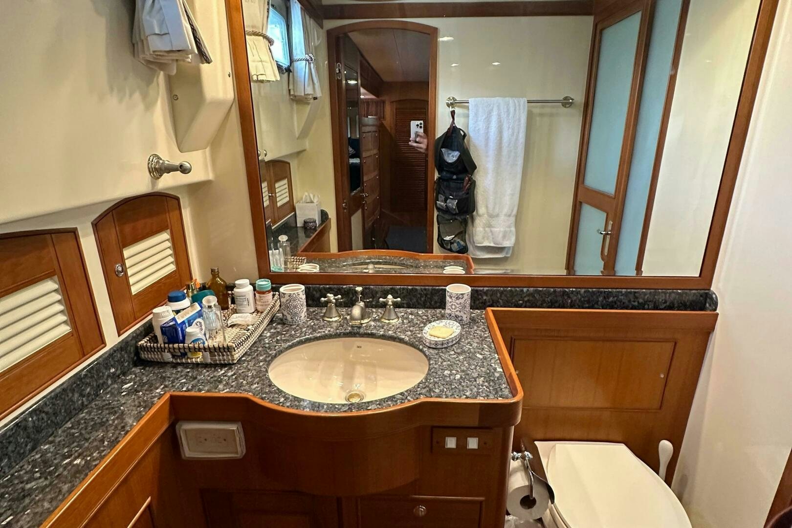 a bathroom with a large mirror aboard MISS STEPHANIE  Yacht for Sale